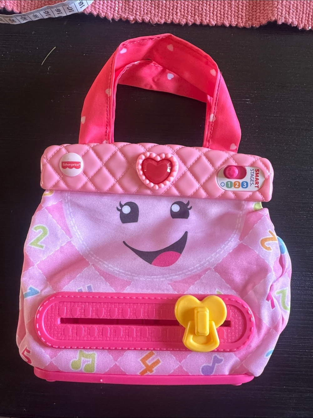 Fisher-Price Pink Musical Learning Purse with Heart Button